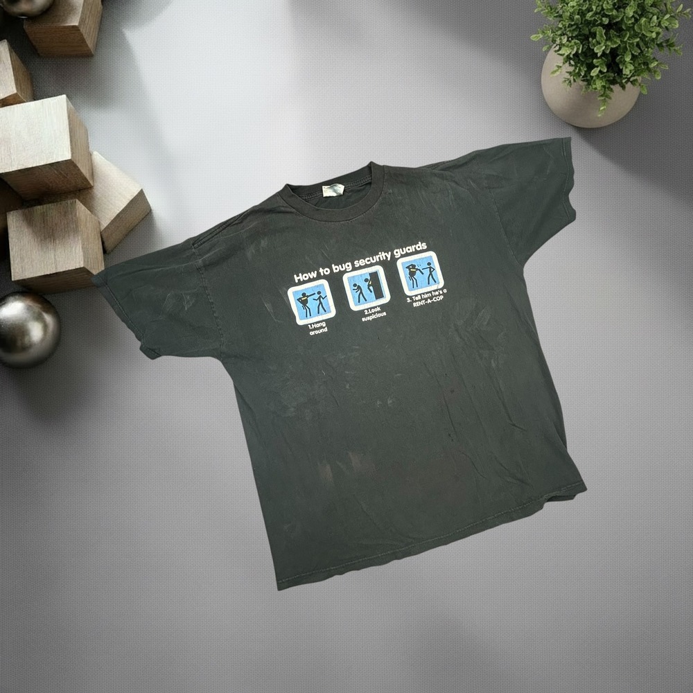 Vintage‎ Optima How To Bug Security Guards Graphic T-Shirt Faded Black XL Y2K